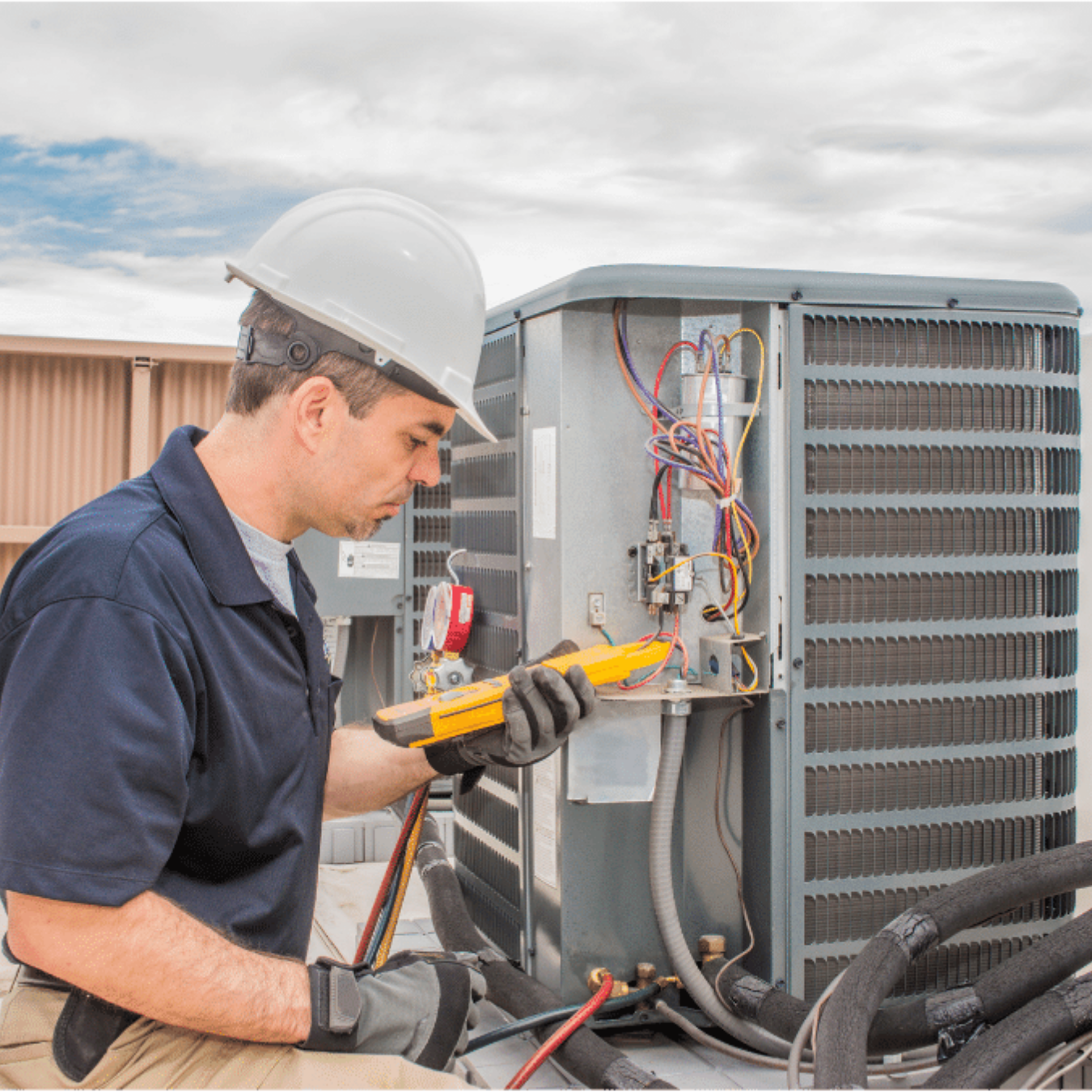 London AC Repair HVAC technician servicing a cooling system in London, Ontario